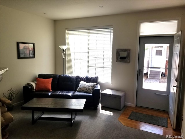 2240 S Pagosa Ct Unit B, Aurora, CO 80013 - living area featuring healthy amount of natural light and baseboards