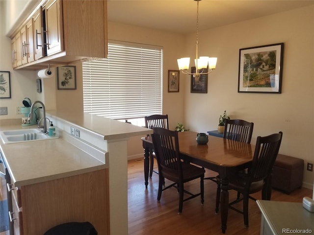 2240 S Pagosa Ct Unit B, Aurora, CO 80013 - dining space with wood finished floors, a chandelier, and baseboards