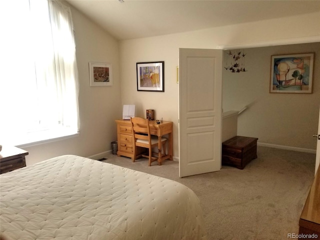 2240 S Pagosa Ct Unit B, Aurora, CO 80013 - bedroom with lofted ceiling, carpet flooring, and baseboards