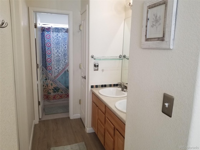 2240 S Pagosa Ct Unit B, Aurora, CO 80013 - bathroom with wood finished floors and double vanity