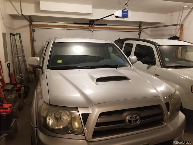 2240 S Pagosa Ct Unit B, Aurora, CO 80013 - garage featuring a garage door opener