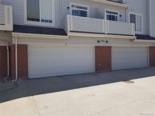 2240 S Pagosa Ct Unit B, Aurora, CO 80013 - garage featuring driveway