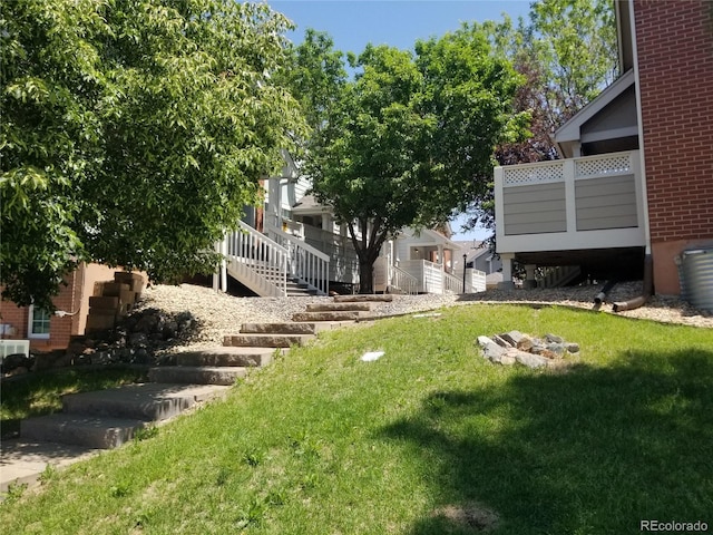 2240 S Pagosa Ct Unit B, Aurora, CO 80013 - view of green lawn featuring stairs