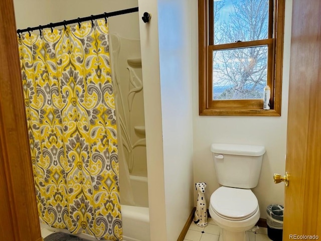 bathroom featuring tile patterned floors, shower / bath combo, and toilet