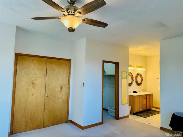 bedroom with connected bathroom and ceiling fan