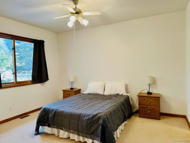 carpeted bedroom with ceiling fan