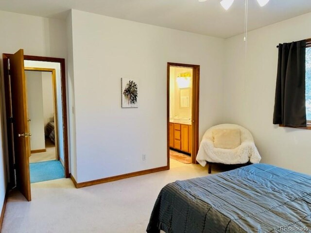 carpeted bedroom with connected bathroom