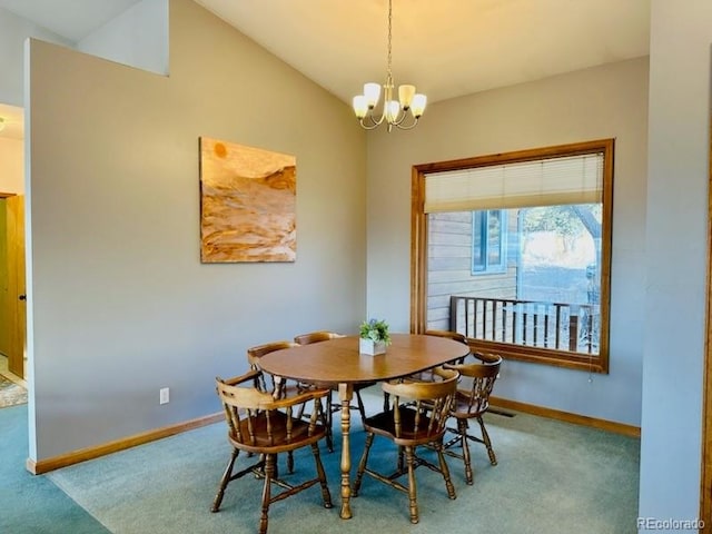 dining area featuring carpet flooring, a chandelier, and lofted ceiling