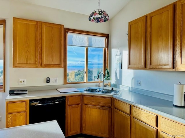 kitchen featuring sink, lofted ceiling, and black dishwasher