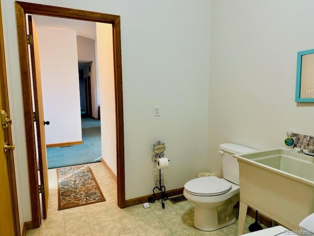 bathroom featuring toilet