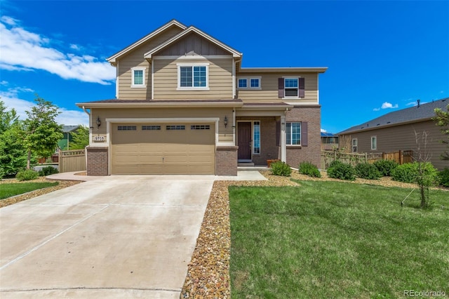 view of front of property with a garage and a front yard