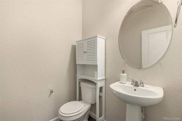 bathroom featuring toilet