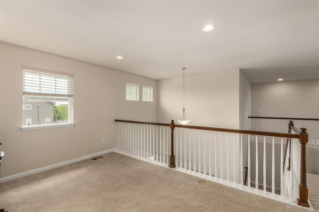 unfurnished room with carpet flooring