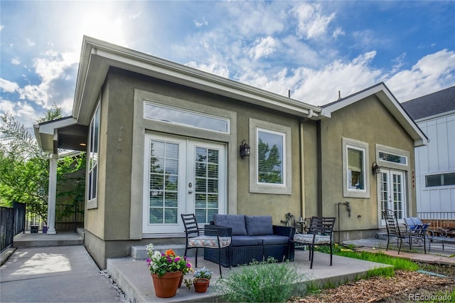 2479 S High St, Denver, CO 80210 - back of property featuring french doors, a patio area, an outdoor living space, and stucco siding