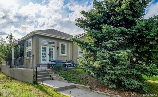 2479 S High St, Denver, CO 80210 - view of front of property with stucco siding and french doors