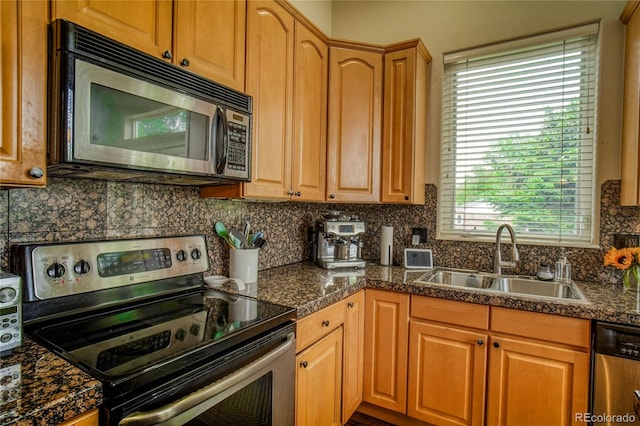 2479 S High St, Denver, CO 80210 - kitchen with appliances with stainless steel finishes and backsplash