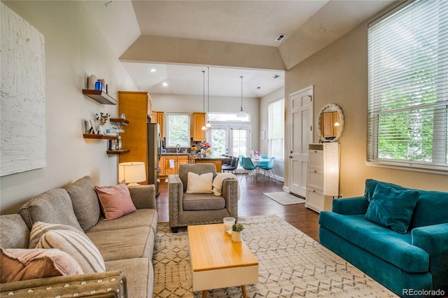 2479 S High St, Denver, CO 80210 - living area featuring wood finished floors, plenty of natural light, high vaulted ceiling, and recessed lighting