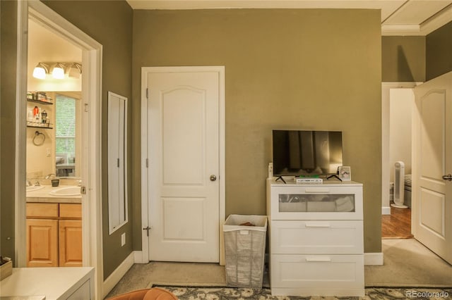 2479 S High St, Denver, CO 80210 - bedroom with light colored carpet and a sink