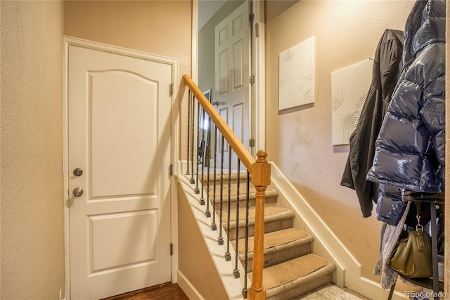 2479 S High St, Denver, CO 80210 - stairway with a textured wall and wood finished floors