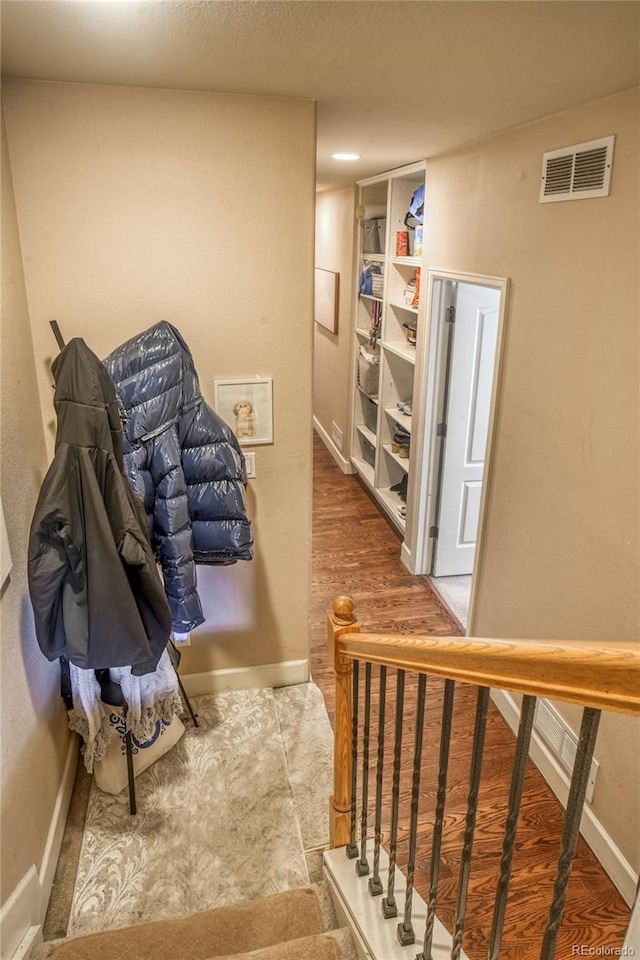 2479 S High St, Denver, CO 80210 - stairway with baseboards and wood finished floors