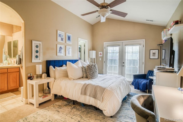 2479 S High St, Denver, CO 80210 - bedroom featuring french doors, access to exterior, arched walkways, lofted ceiling, and ensuite bath