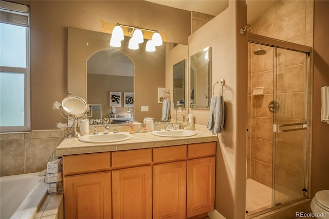 2479 S High St, Denver, CO 80210 - bathroom with a stall shower, double vanity, and a garden tub