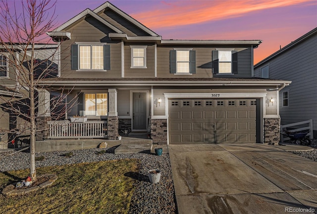 view of front of home featuring a garage and covered porch