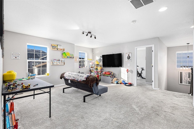 living room featuring carpet and a textured ceiling