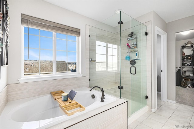 bathroom with plus walk in shower and tile patterned flooring