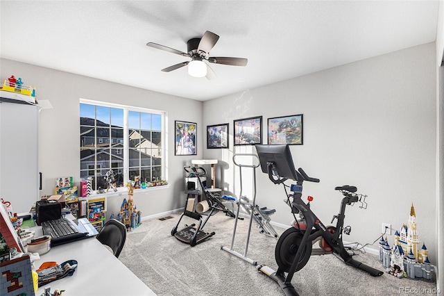 workout area featuring ceiling fan and carpet flooring