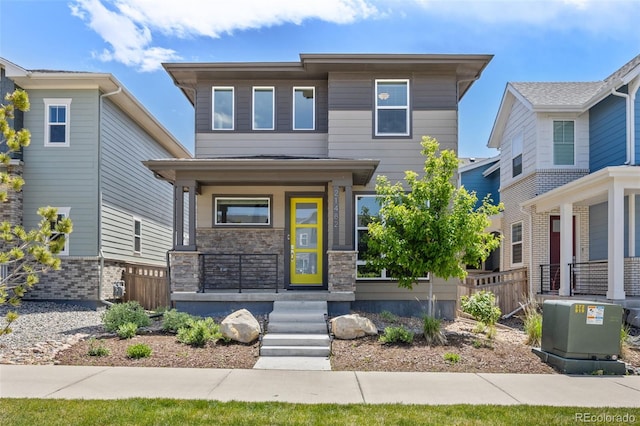 21482 E 60th Ave, Aurora, CO 80019 - view of front facade featuring covered porch and stone siding