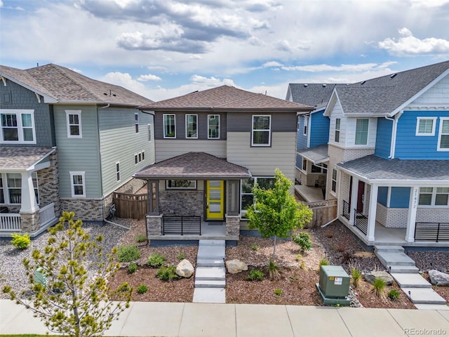 21482 E 60th Ave, Aurora, CO 80019 - view of front of home featuring a porch and stone siding