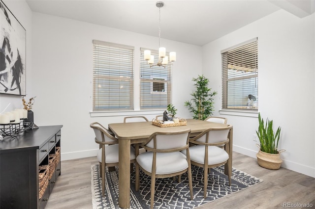 21482 E 60th Ave, Aurora, CO 80019 - dining space with a chandelier, light wood-style flooring, and baseboards