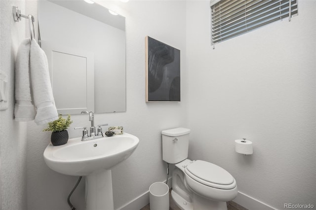 21482 E 60th Ave, Aurora, CO 80019 - half bath featuring baseboards and toilet