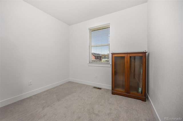 21482 E 60th Ave, Aurora, CO 80019 - empty room with baseboards and light colored carpet