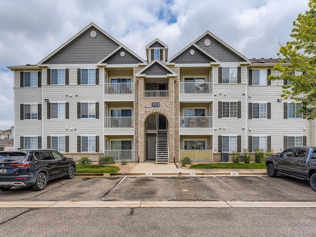 15700 E Jamison Dr Unit 7-203, Englewood, CO 80112 - view of property with uncovered parking