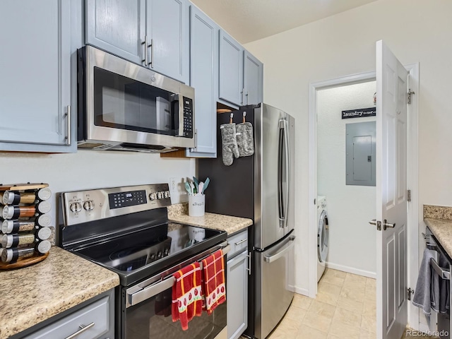15700 E Jamison Dr Unit 7-203, Englewood, CO 80112 - kitchen with stainless steel appliances, electric panel, and independent washer and dryer