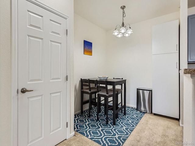 15700 E Jamison Dr Unit 7-203, Englewood, CO 80112 - dining space featuring a chandelier and carpet floors