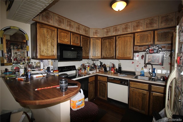 kitchen with sink and white appliances