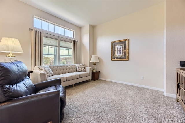 living room featuring carpet floors and baseboards