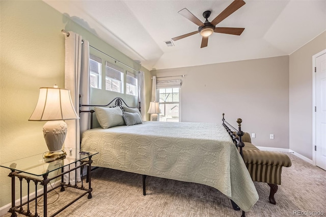 bedroom featuring visible vents, carpet floors, baseboards, a ceiling fan, and vaulted ceiling