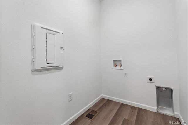 19100 E 96th Pl, Commerce City, CO 80022 - laundry room featuring hookup for a washing machine, electric dryer hookup, baseboards, and wood finished floors