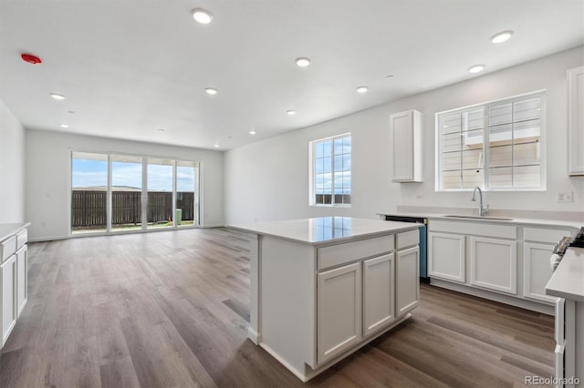 19100 E 96th Pl, Commerce City, CO 80022 - kitchen featuring a sink, healthy amount of natural light, wood finished floors, a kitchen island, and recessed lighting