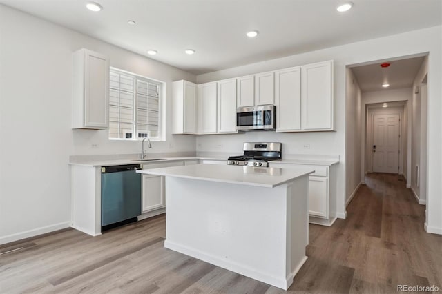 19100 E 96th Pl, Commerce City, CO 80022 - kitchen featuring stainless steel appliances, light countertops, light wood-type flooring, and recessed lighting