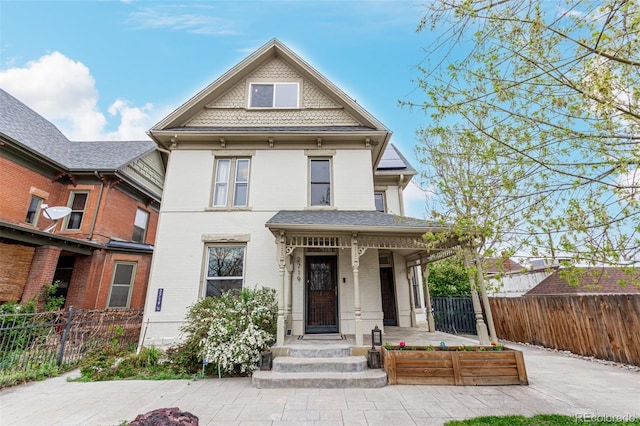 2719 W 32nd Ave, Denver, CO 80211 - victorian-style house featuring a porch and brick siding