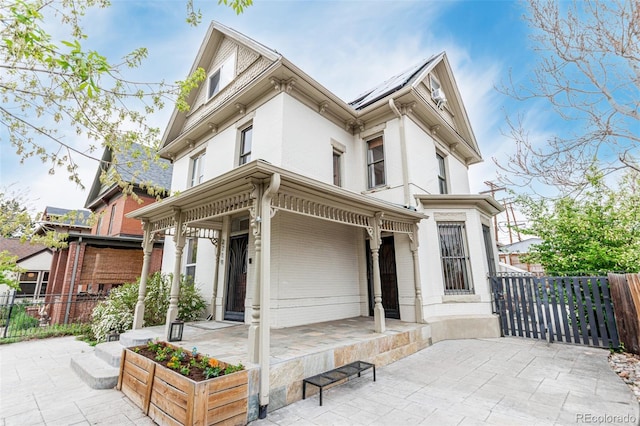 2719 W 32nd Ave, Denver, CO 80211 - view of front facade featuring brick siding and a patio area