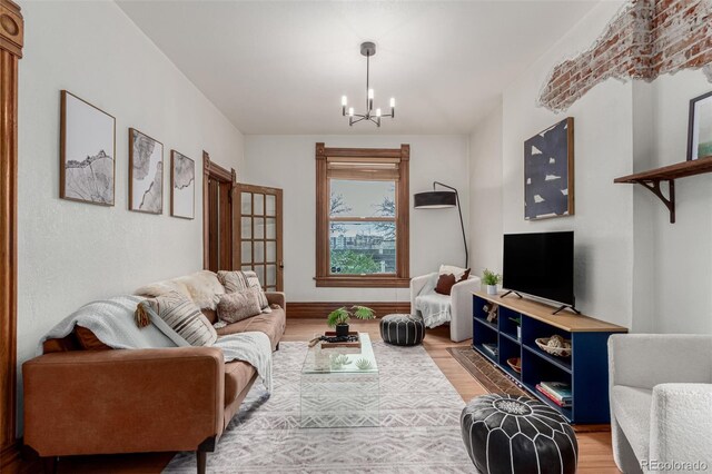 2719 W 32nd Ave, Denver, CO 80211 - living area featuring light wood-type flooring and a chandelier