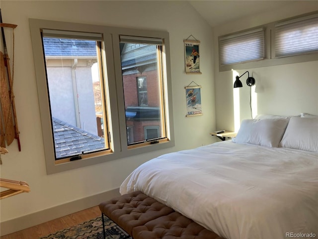 2719 W 32nd Ave, Denver, CO 80211 - bedroom featuring wood finished floors and lofted ceiling