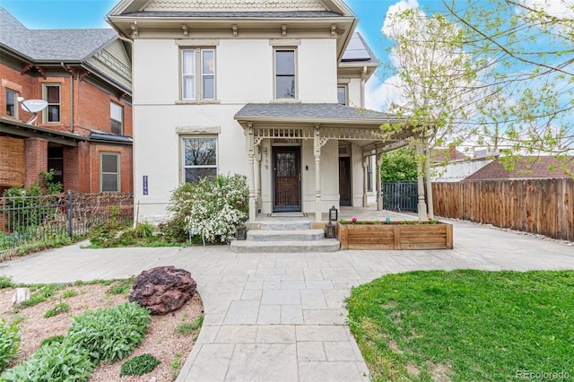 2719 W 32nd Ave, Denver, CO 80211 - victorian home featuring a porch and brick siding