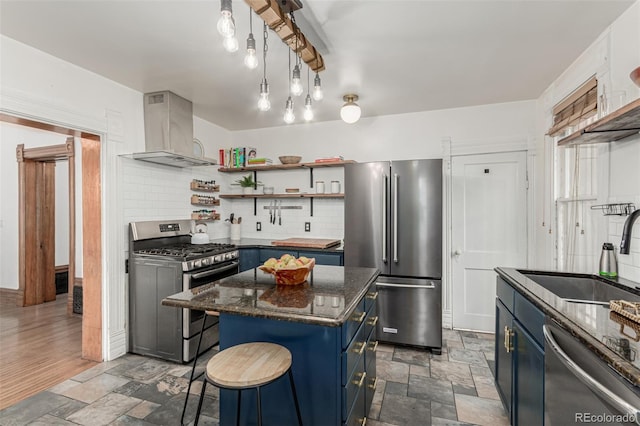 2719 W 32nd Ave, Denver, CO 80211 - kitchen with appliances with stainless steel finishes, wall chimney exhaust hood, blue cabinetry, and open shelves